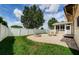 Landscaped backyard with patio and fire pit at 1553 Regal Mist Loop, Trinity, FL 34655