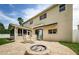 Backyard patio with fire pit and seating area at 1553 Regal Mist Loop, Trinity, FL 34655