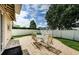 Backyard patio with seating and a large tree at 1553 Regal Mist Loop, Trinity, FL 34655