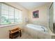 Relaxing bathroom with soaking tub and window view at 1553 Regal Mist Loop, Trinity, FL 34655
