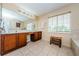 Double vanity bathroom with large mirror and tiled floors at 1553 Regal Mist Loop, Trinity, FL 34655