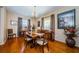 Bright dining room with hardwood floors and elegant furnishings at 1553 Regal Mist Loop, Trinity, FL 34655