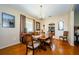 Formal dining room with hardwood floors, chandelier, and large windows at 1553 Regal Mist Loop, Trinity, FL 34655