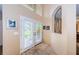 Bright entryway with double doors leading to the backyard at 1553 Regal Mist Loop, Trinity, FL 34655