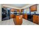 Modern kitchen with stainless steel appliances and granite countertops at 1553 Regal Mist Loop, Trinity, FL 34655