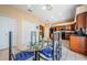 Kitchen with breakfast nook, glass-top table, and blue accents at 1553 Regal Mist Loop, Trinity, FL 34655