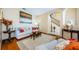 Living room features hardwood floors, neutral decor, and open floor plan at 1553 Regal Mist Loop, Trinity, FL 34655