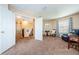 Bright loft area features a sitting area and access to upper floor at 1553 Regal Mist Loop, Trinity, FL 34655