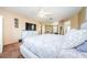 Main bedroom with large bed, dresser, and flat-screen TV at 1553 Regal Mist Loop, Trinity, FL 34655