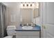 Traditional bathroom with neutral walls, blue countertops, and a shower curtain at 15555 Martinmeadow Dr, Lithia, FL 33547