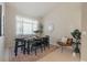 The dining room has a large window and seating for six at 15555 Martinmeadow Dr, Lithia, FL 33547