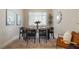Dining area featuring a large window, a wooden table, and seating for six at 15555 Martinmeadow Dr, Lithia, FL 33547