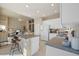 The kitchen has a breakfast bar with views to the living room at 15555 Martinmeadow Dr, Lithia, FL 33547