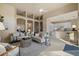 The living room is bright and has an open concept to the kitchen and dining areas at 15555 Martinmeadow Dr, Lithia, FL 33547