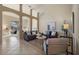 Open-concept living room with neutral tones and plenty of natural light at 15555 Martinmeadow Dr, Lithia, FL 33547