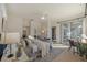 Inviting main bedroom with a comfortable seating area, desk space and sliding doors to the outside area at 15555 Martinmeadow Dr, Lithia, FL 33547