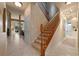 Inviting foyer features stairs leading up to the second level and an open layout at 15555 Martinmeadow Dr, Lithia, FL 33547