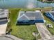 Single-story home with a large backyard, located on a canal at 1806 Burlington Cir, Sun City Center, FL 33573