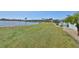 Lakefront backyard with grassy area at 1806 Burlington Cir, Sun City Center, FL 33573