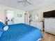 Spacious bedroom with a comfortable bed and white dresser at 18304 Gulf Blvd # 619, Redington Shores, FL 33708