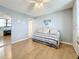 Bedroom with daybed, built-in desk and hardwood floors at 18304 Gulf Blvd # 619, Redington Shores, FL 33708