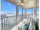 Sunroom with ocean view, seating area, and tiled floor at 18304 Gulf Blvd # 619, Redington Shores, FL 33708