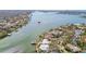 Aerial view of waterfront property with boat at 1897 Clearwater Harbor Dr, Largo, FL 33770