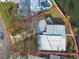 Aerial view of a waterfront property with unique roofline at 1897 Clearwater Harbor Dr, Largo, FL 33770