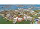 Aerial view of waterfront property with large lot and boat dock at 1897 Clearwater Harbor Dr, Largo, FL 33770
