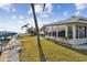 Side yard view of home and waterfront access at 1897 Clearwater Harbor Dr, Largo, FL 33770