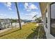 Landscaped backyard with water access and dock at 1897 Clearwater Harbor Dr, Largo, FL 33770