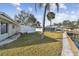 Backyard with grassy area and canal view at 1897 Clearwater Harbor Dr, Largo, FL 33770