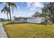 Single story home with white fence and waterfront access at 1897 Clearwater Harbor Dr, Largo, FL 33770