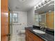 Clean bathroom with updated vanity and tiled shower at 1903 Oro Ct, Clearwater, FL 33764