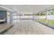 Large screened porch with tiled floor, perfect for relaxing outdoors at 1903 Oro Ct, Clearwater, FL 33764