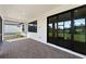 Relaxing screened patio with pavers and sliding glass doors at 1919 Pepper Grass Dr, North Port, FL 34289