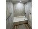 Updated bathroom with tub and modern tile at 19505 Quesada Ave # O105, Port Charlotte, FL 33948