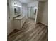 Bathroom with granite countertop, updated vanity, and mirrored closet at 19505 Quesada Ave # O105, Port Charlotte, FL 33948