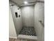 Updated walk-in shower with modern tile and fixtures at 19505 Quesada Ave # O105, Port Charlotte, FL 33948