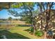 Serene backyard view overlooking a pond and golf course at 2112 Gulf View Blvd, Dunedin, FL 34698