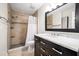Bathroom with marble vanity, shower, and updated fixtures at 2112 Gulf View Blvd, Dunedin, FL 34698