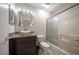 Clean bathroom with a large mirror and tub shower combo at 2112 Gulf View Blvd, Dunedin, FL 34698