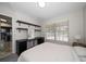 Bedroom with a desk and kitchen view at 2112 Gulf View Blvd, Dunedin, FL 34698