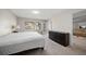 Main bedroom with a dresser and access to the patio at 2112 Gulf View Blvd, Dunedin, FL 34698