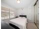 Cozy bedroom with striped bedding and built-in shelving at 2112 Gulf View Blvd, Dunedin, FL 34698
