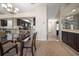 Bright dining area with glass table and dark wood chairs at 2112 Gulf View Blvd, Dunedin, FL 34698