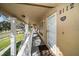 Condo hallway with white railings and light-colored walls at 2112 Gulf View Blvd, Dunedin, FL 34698