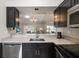Kitchen with stainless steel appliances and white countertops at 2112 Gulf View Blvd, Dunedin, FL 34698