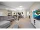 Open living area with sectional sofa, TV and dining area at 2112 Gulf View Blvd, Dunedin, FL 34698