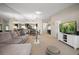 Spacious living room with sectional sofa and large TV at 2112 Gulf View Blvd, Dunedin, FL 34698